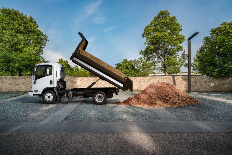 Chevrolet LCF landscape dump parked near wall with mulch