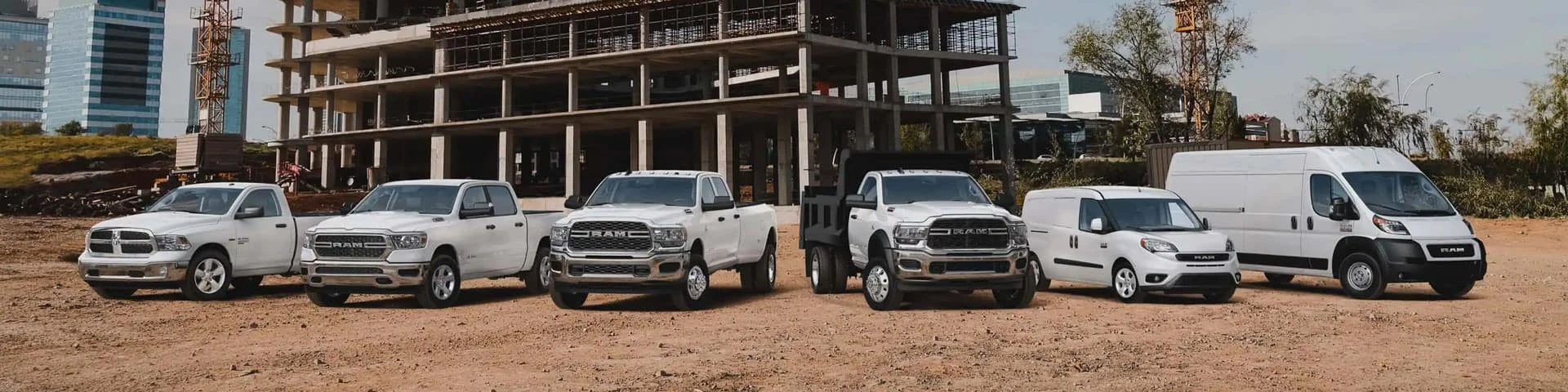 A lineup of Ram Commercial trucks and vans at AutoNation Chrysler Dodge Jeep Ram of North Phoenix in Phoenix, AZ.