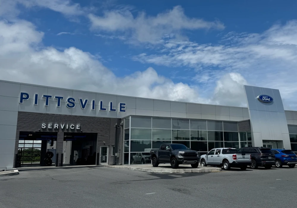 Storefront of Pittsville Ford commercial dealership in MD, offering financing on work trucks and vans for sale.
