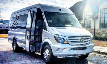 Silver LA West Luxury Coach van with open entry door, highlighting premium shuttle options from Mercedes-Benz of Birmingham.