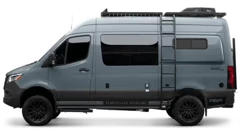 Side profile of a grey Storyteller Overland Stealth MODE van, showing its sleek design and roof-mounted gear, perfect for discreet adventure.