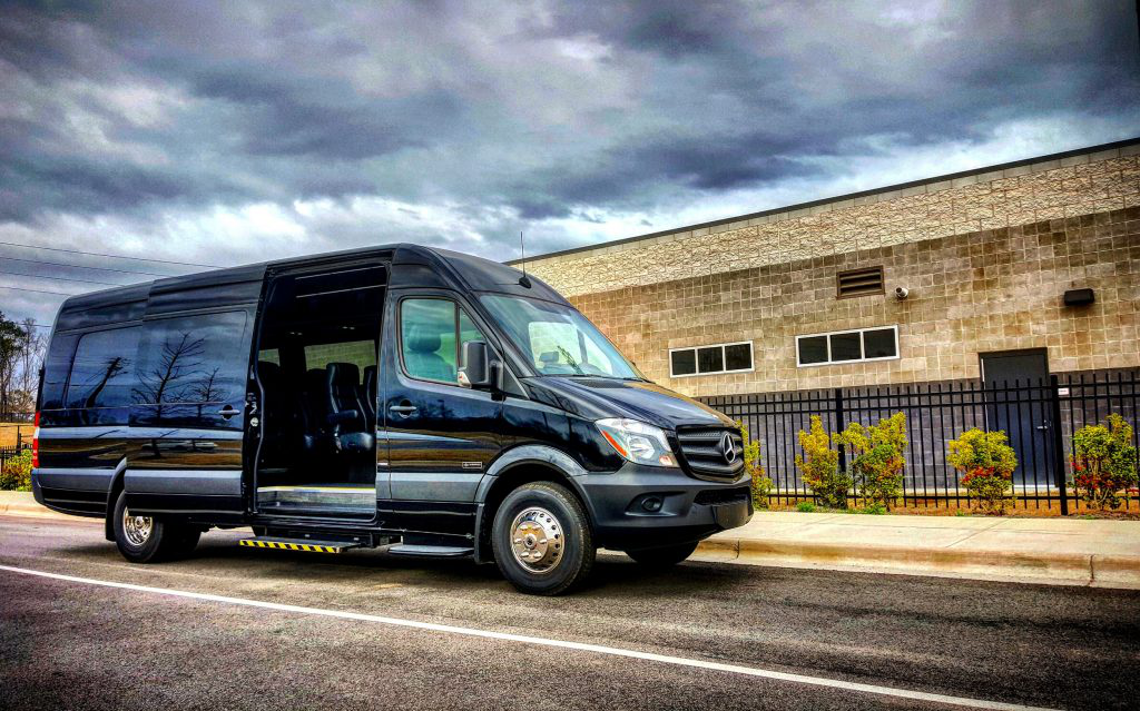 Black LA West Luxury Coach with open side door, showcasing luxury transport options from Mercedes-Benz of Birmingham.