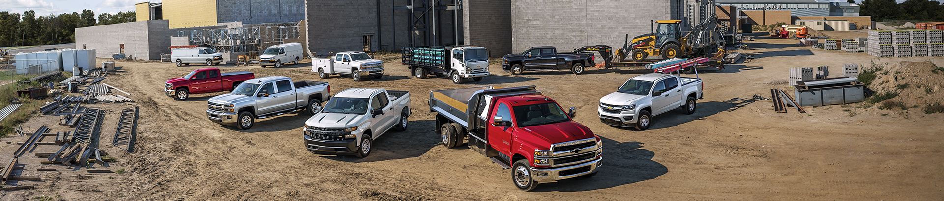 A Chevrolet work vehicle lineup at a construction site in Wake Forest, NC.